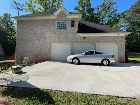 Brick home garage side before painting