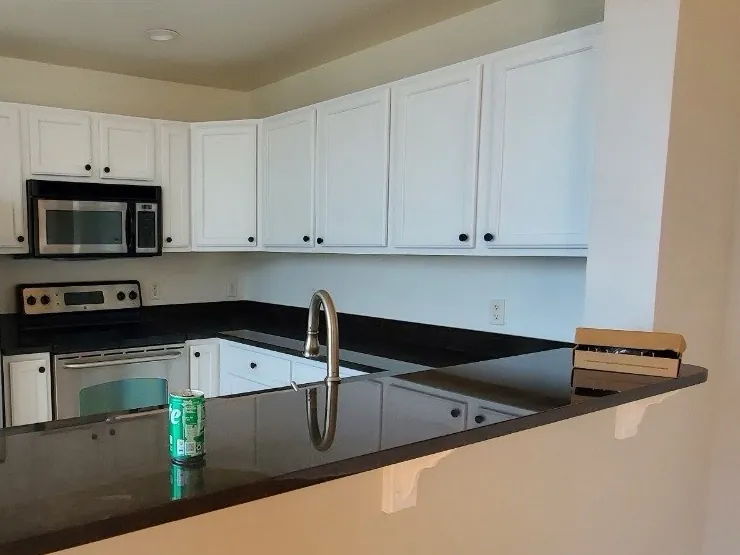 Kitchen with cabinets painted white