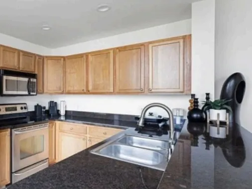 Kitchen with oak cabinets before painting